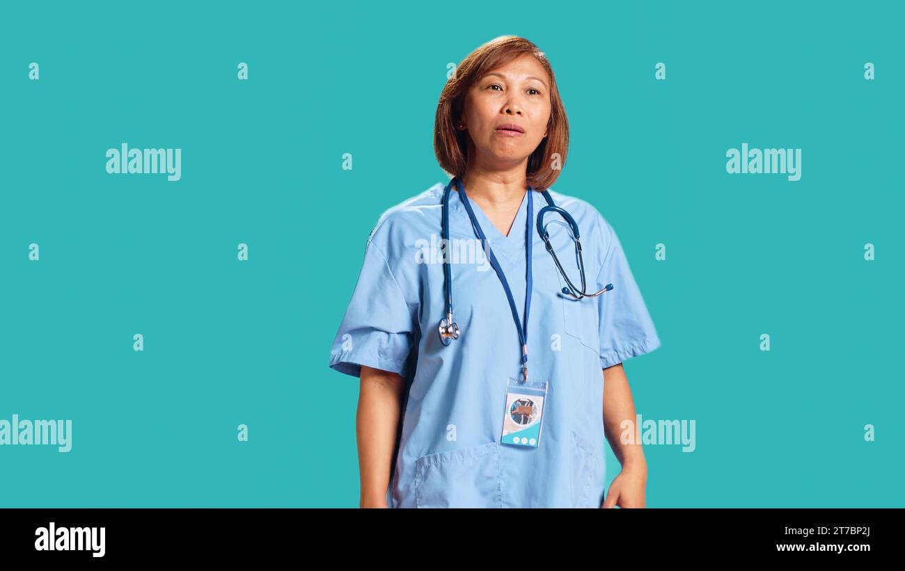 Enraged hospital employee yelling furiously and threateningly motioning ...