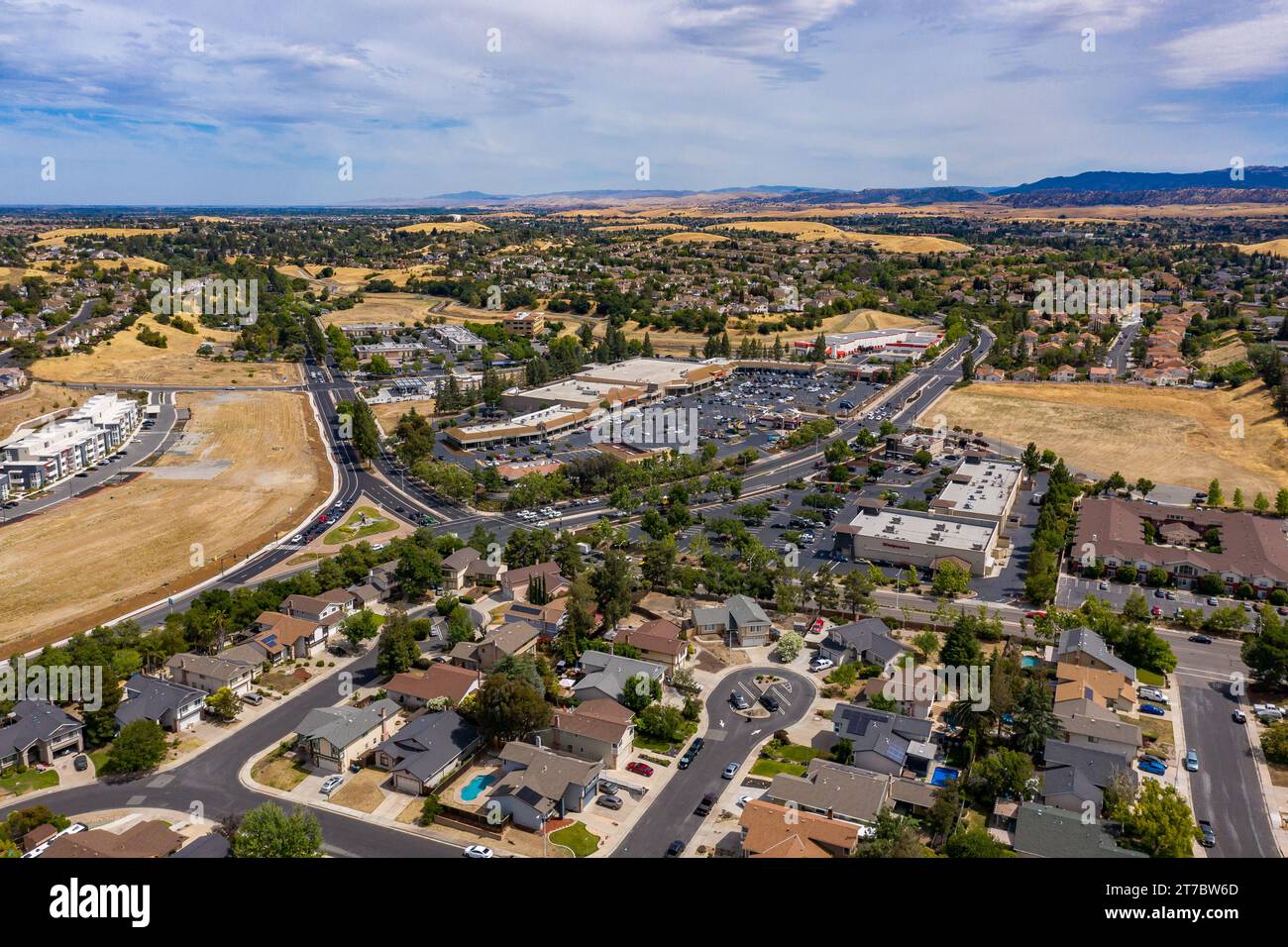 Drone images over a shopping center in Antioch, California. With cars