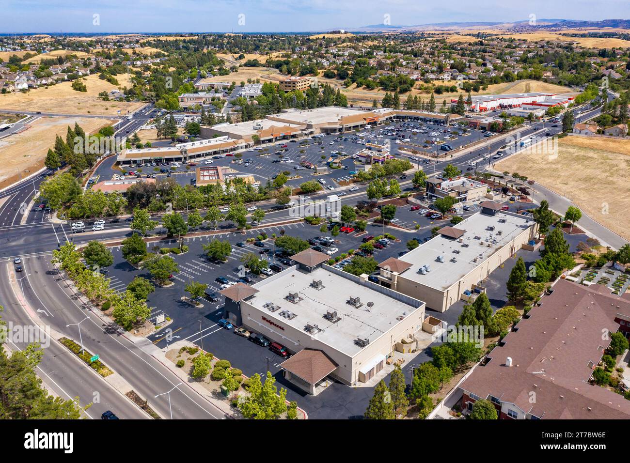 Drone images over a shopping center in Antioch, California. With cars