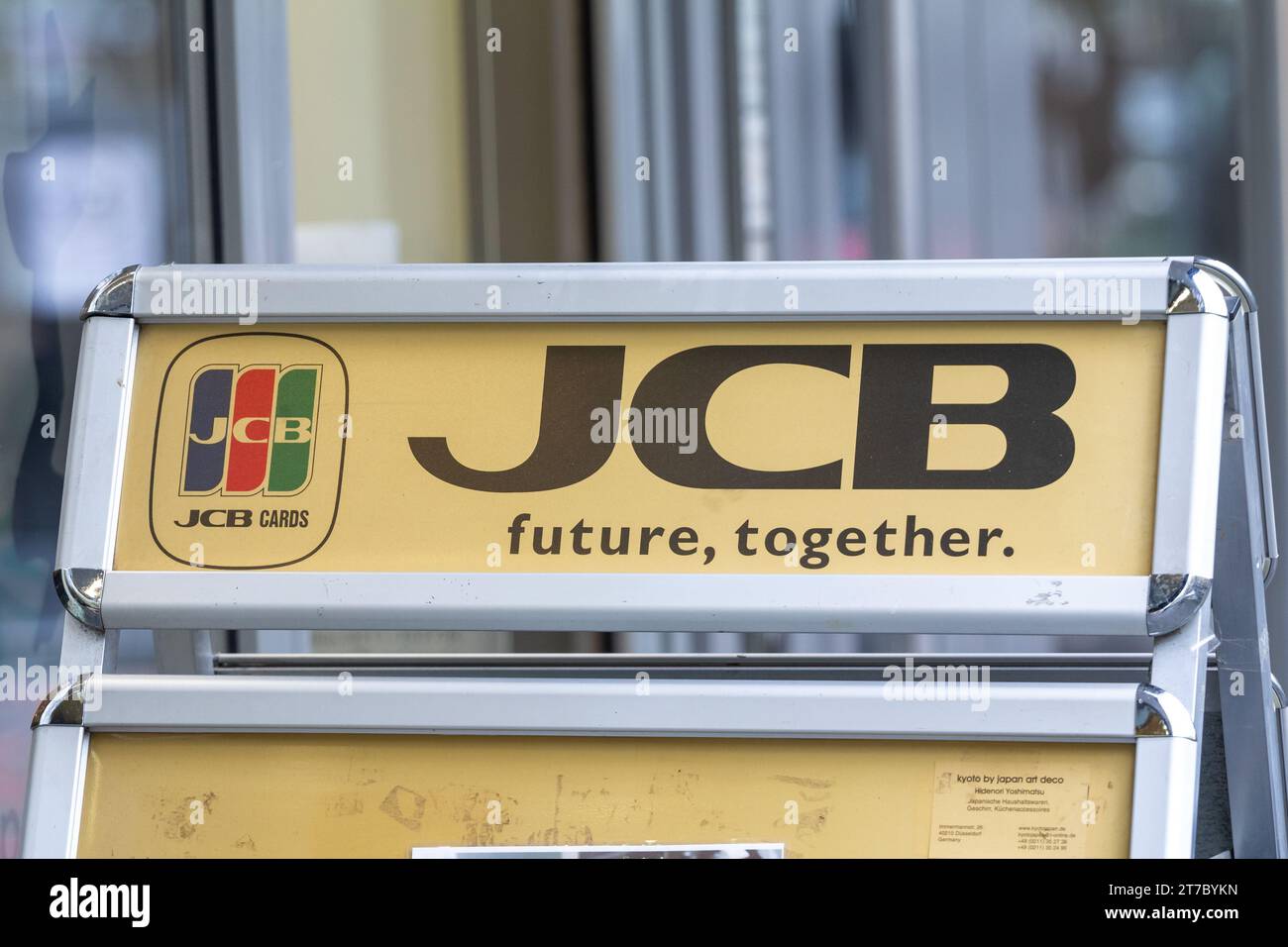 Picture of a sign with the logo of JCB in Dusseldorf, Germany. JCB Co., Ltd., formerly Japan Credit Bureau, is a credit card company based in Tokyo, J Stock Photo