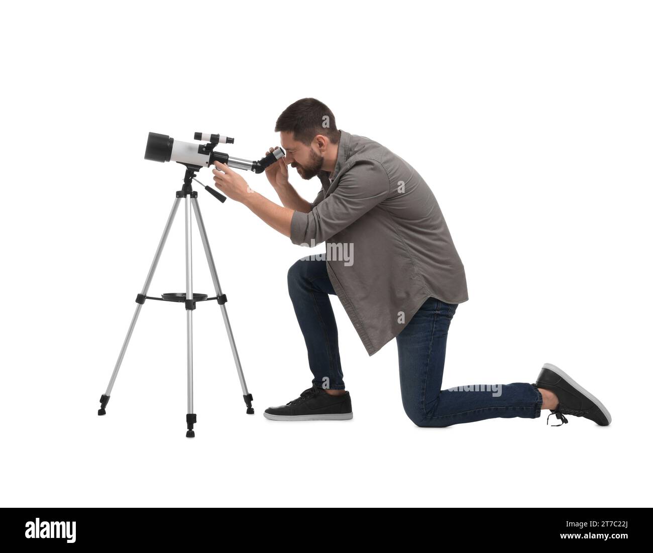 Astronomer looking at stars through telescope on white background Stock