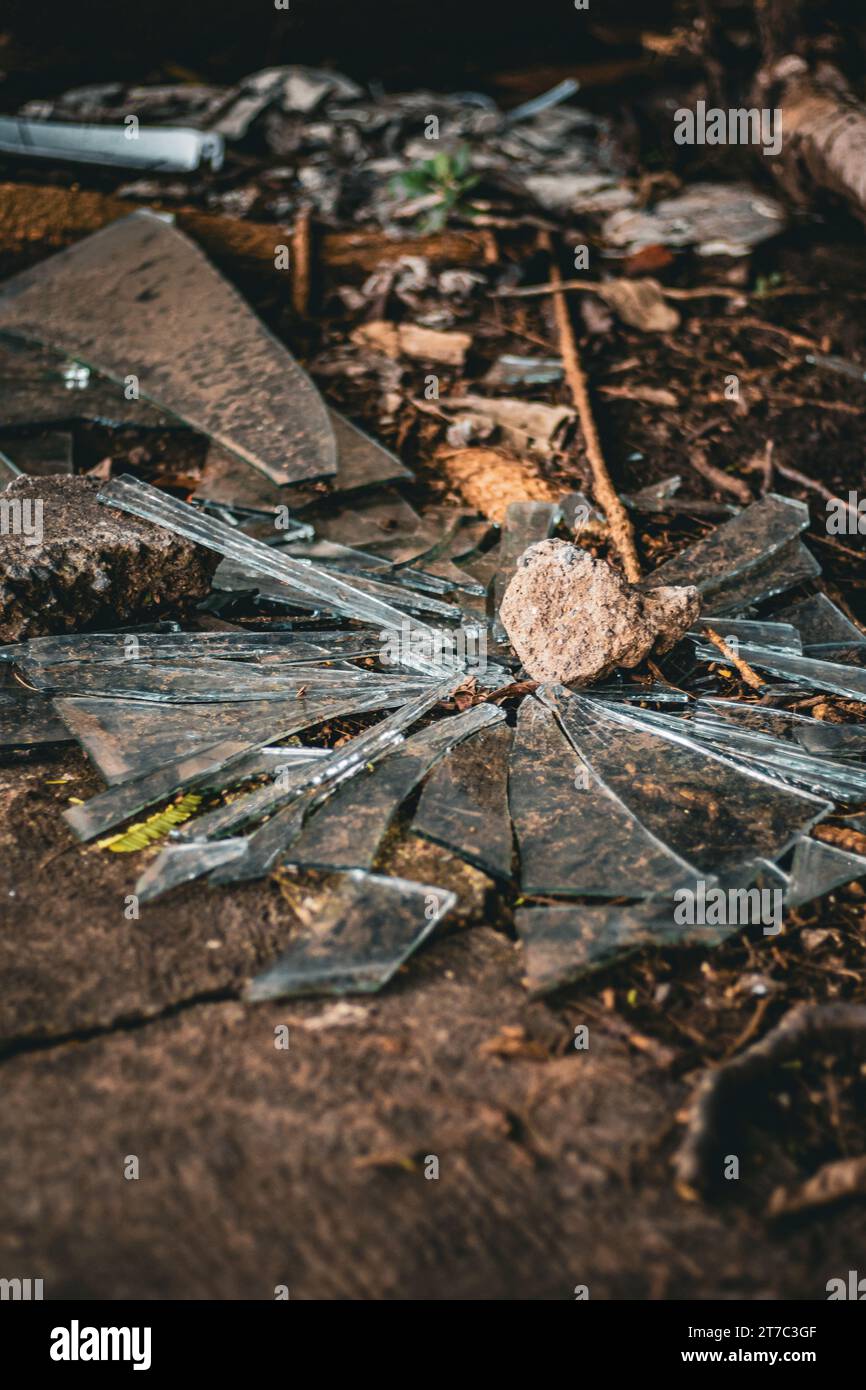 Broken glass, shards, stone, on ground, accident, violence, Mexico 2023 Stock Photo
