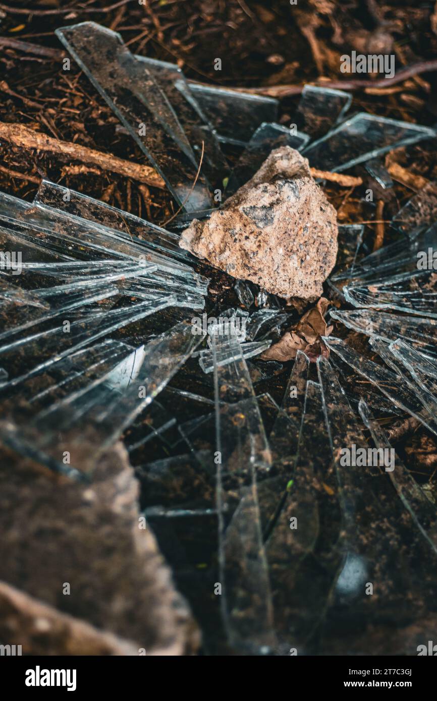 Broken glass, shards, stone, on ground, Mexico 2023 Stock Photo