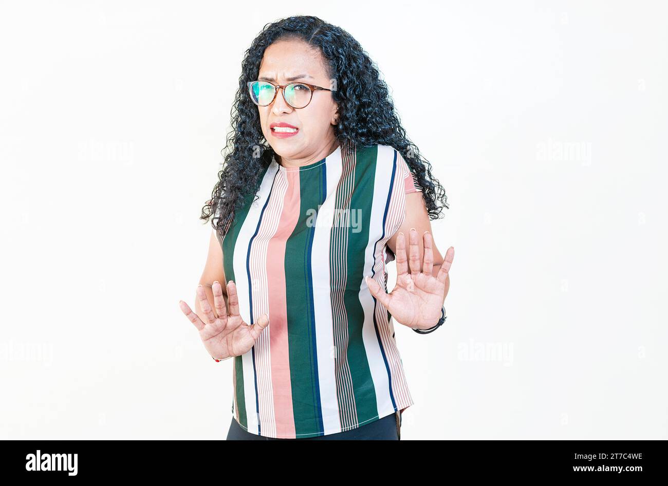 Afro woman with face disgusted on isolated background.. Woman in glasses with disgust face isolated Stock Photo