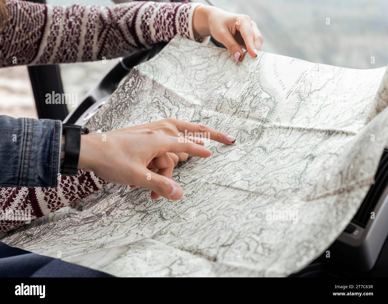 Close up hands pointing map Stock Photo - Alamy