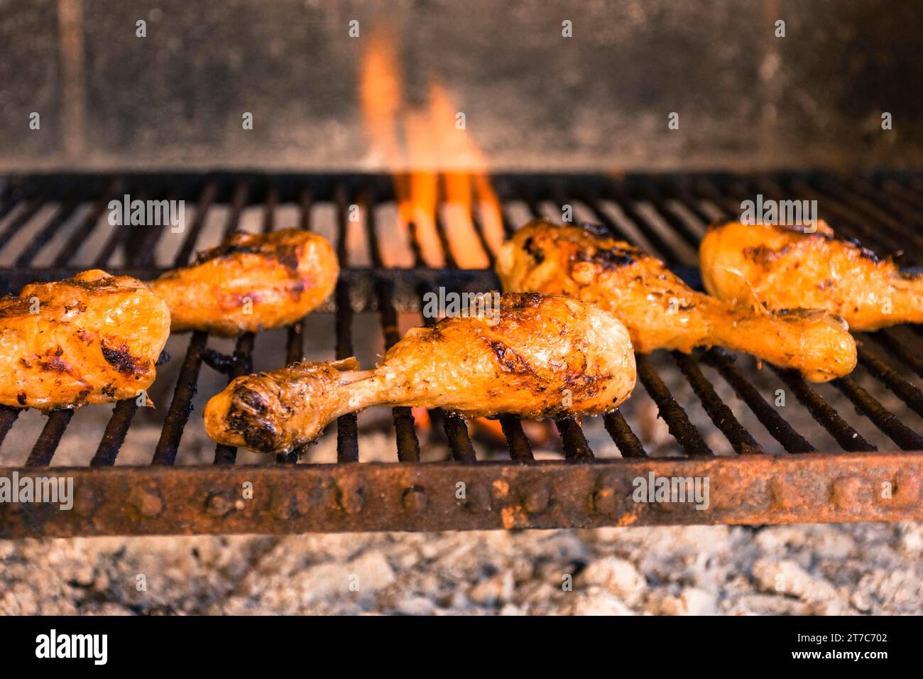 Grilled chicken legs hot grill with heavy fire Stock Photo Alamy