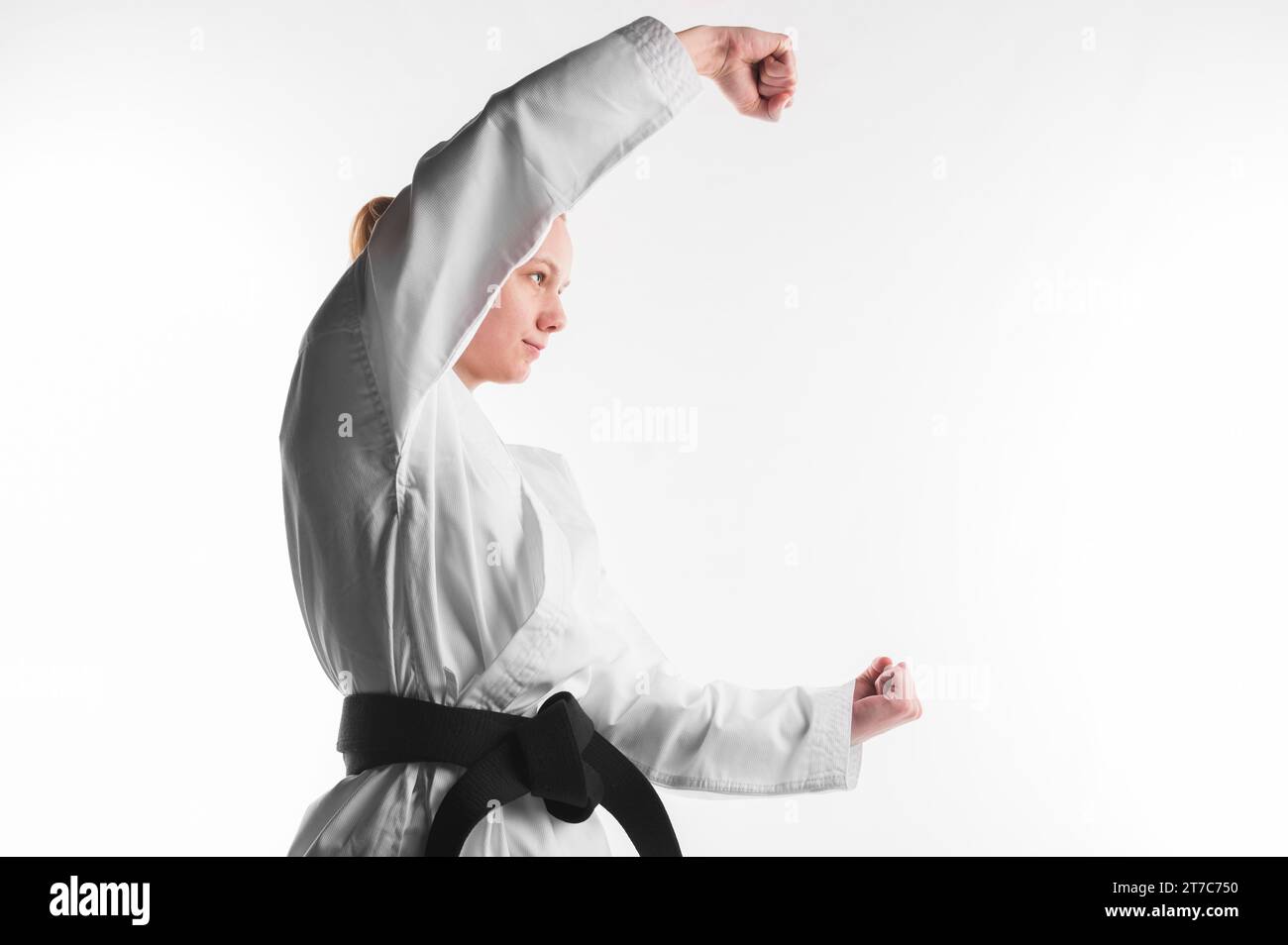 Karate fighter posing side view Stock Photo