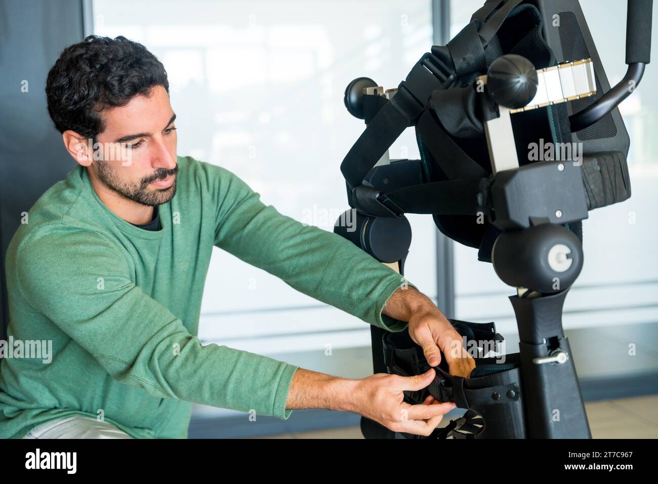 Interview Skeleton Engineering Mechanical exoskeleton engineer checking the mechanisms before the ...