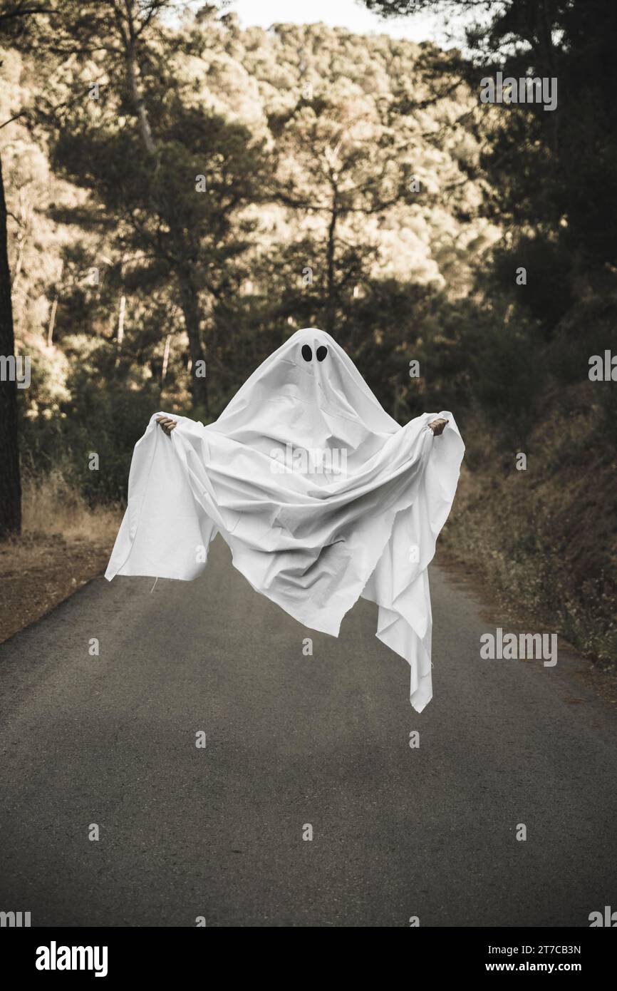 Human gloomy ghost costume flying countryside Stock Photo
