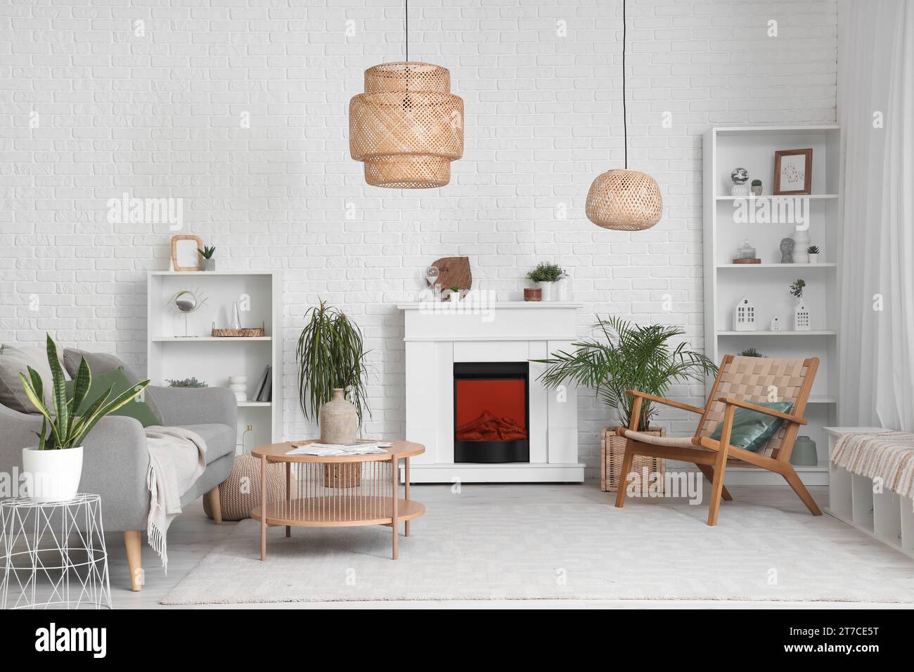 Interior of living room with modern fireplace and sofa Stock Photo - Alamy