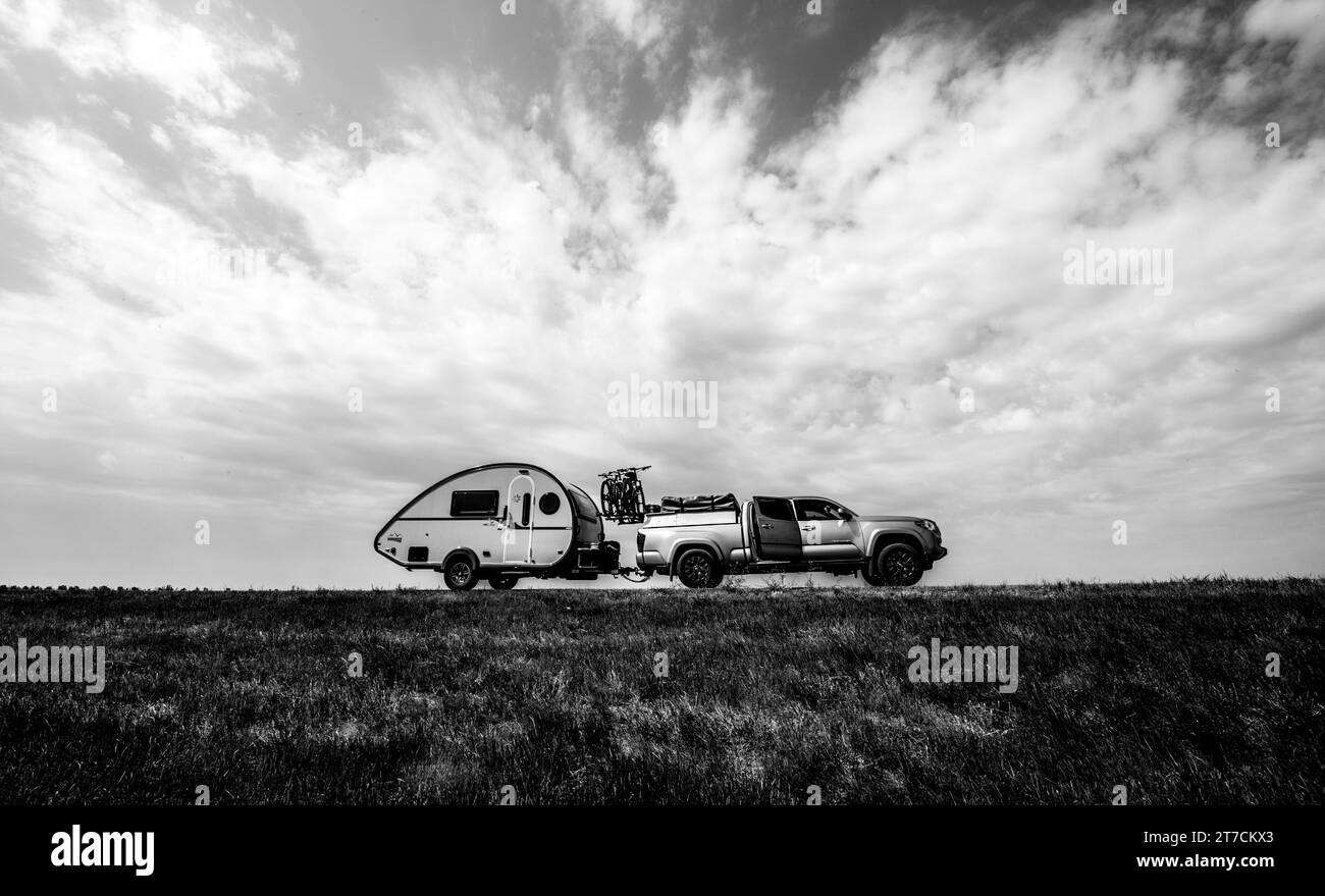 A camping RV rig. View of the Rig with a dramatic clouds background ...
