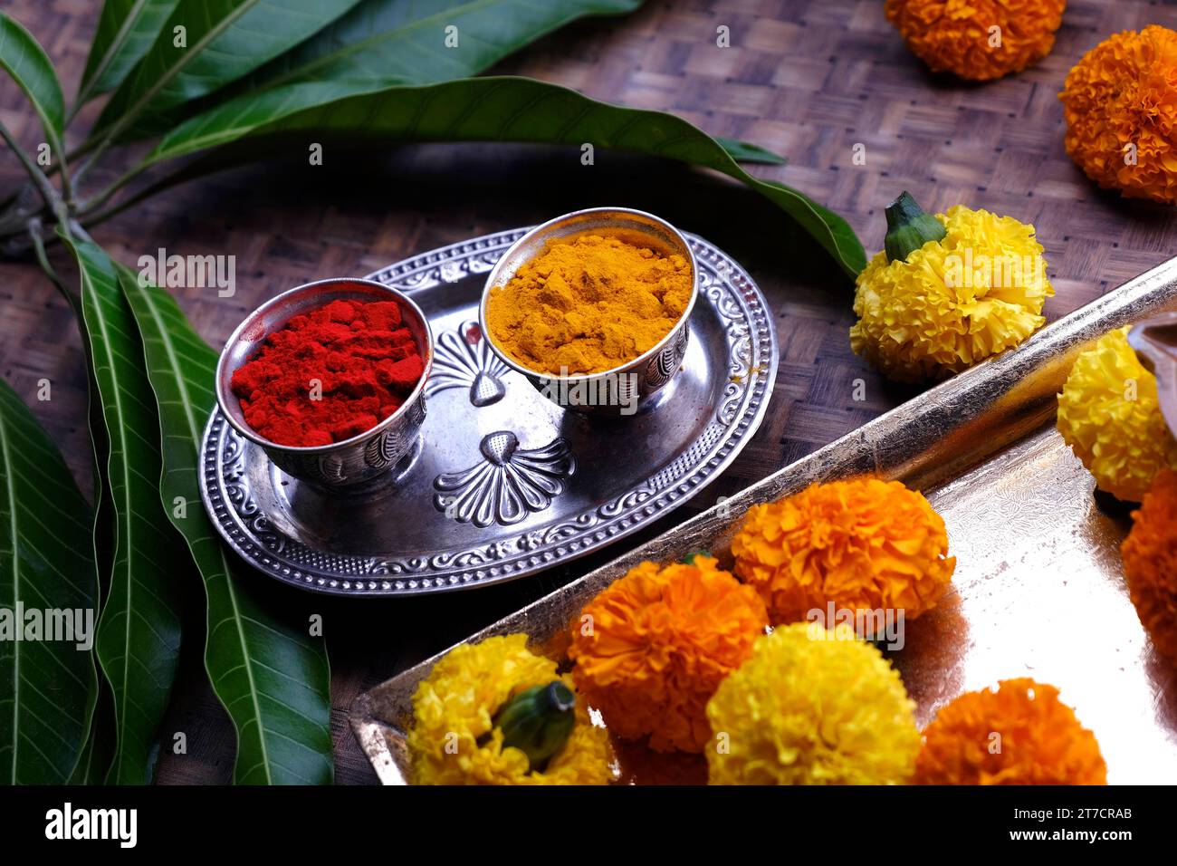India's tradition Turmeric (Haldi) powder and kumkum powder in silver bowl for pooja. Stock Photo