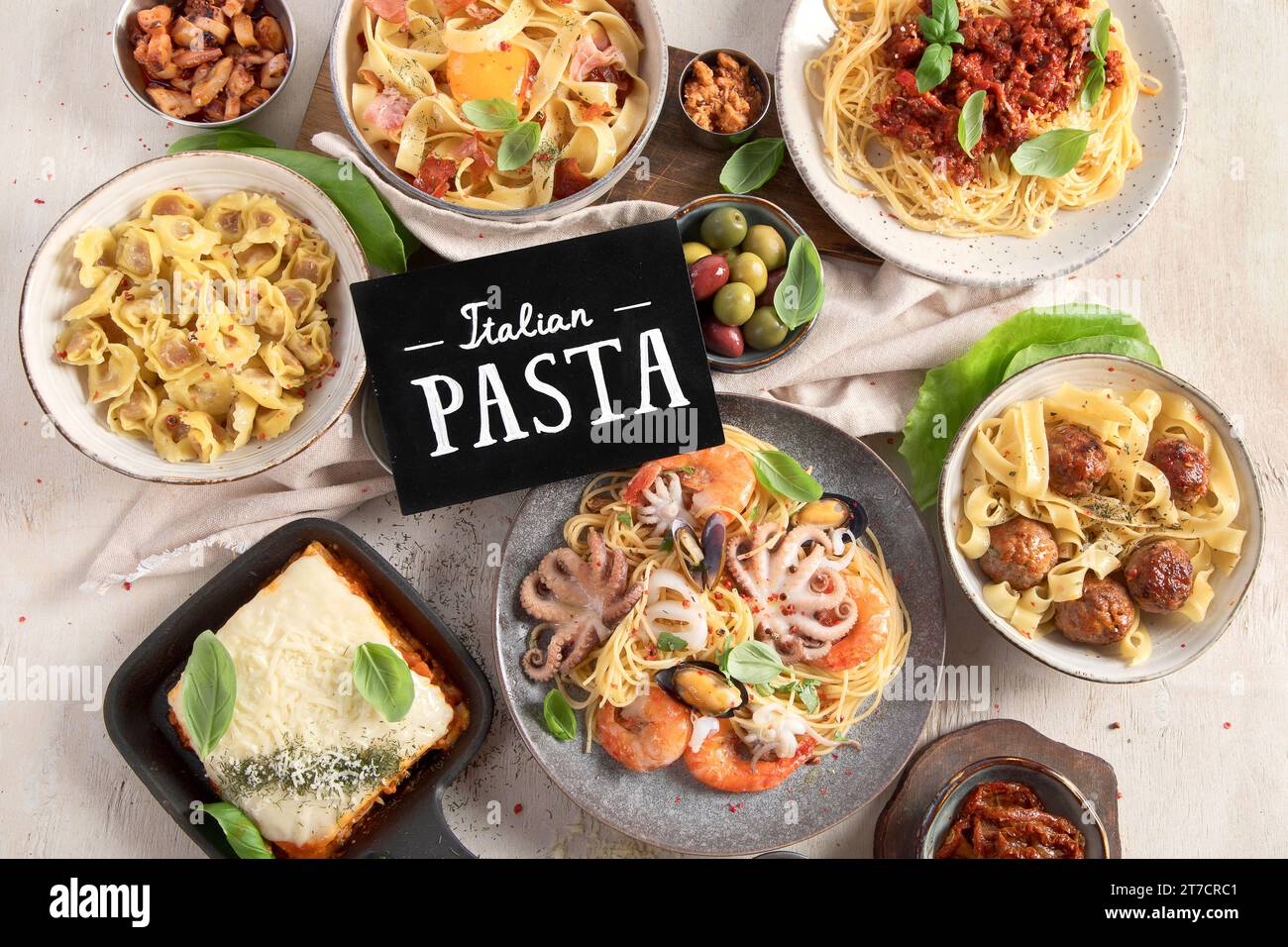 Assortment of Italian pasta dishes on light bachground. Traditional food concept. Top view Stock Photo