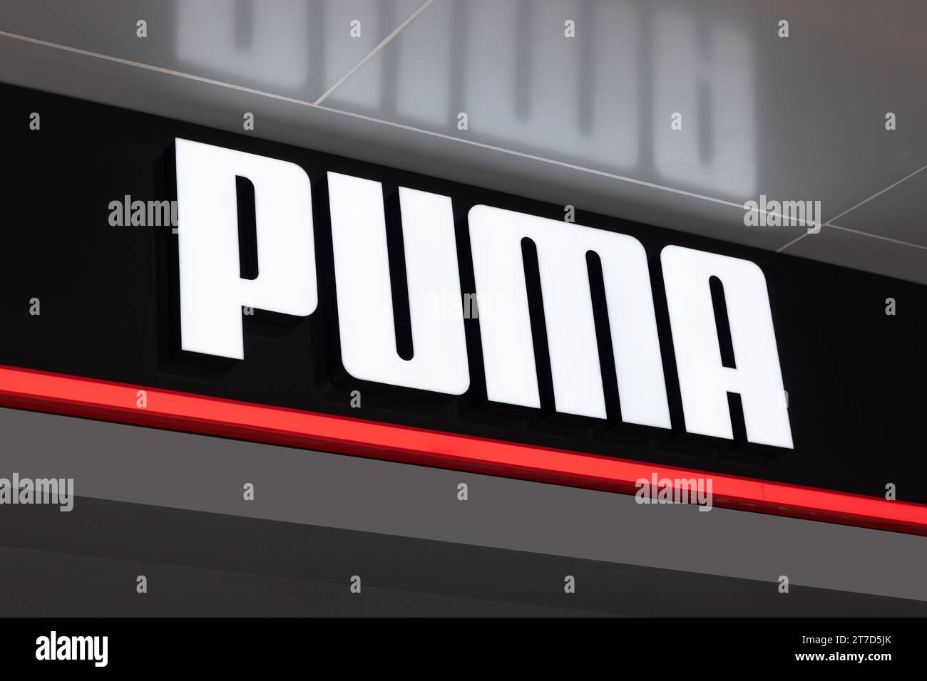 Puma SE brand logo on at Puma store. Puma designs and manufactures athletic and casual footwear, apparel and accessories, headquartered in Herzogenaur Stock Photo