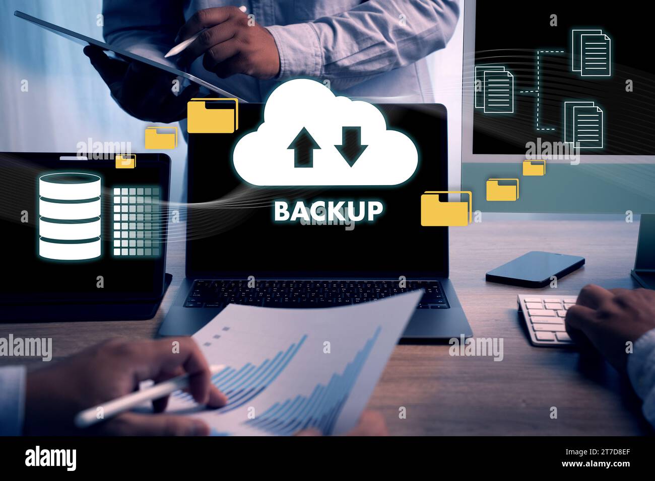 Man uses computers. Online backup technology, data storage on a laptop, digital cloud, database information Cloud storage technology Stock Photo