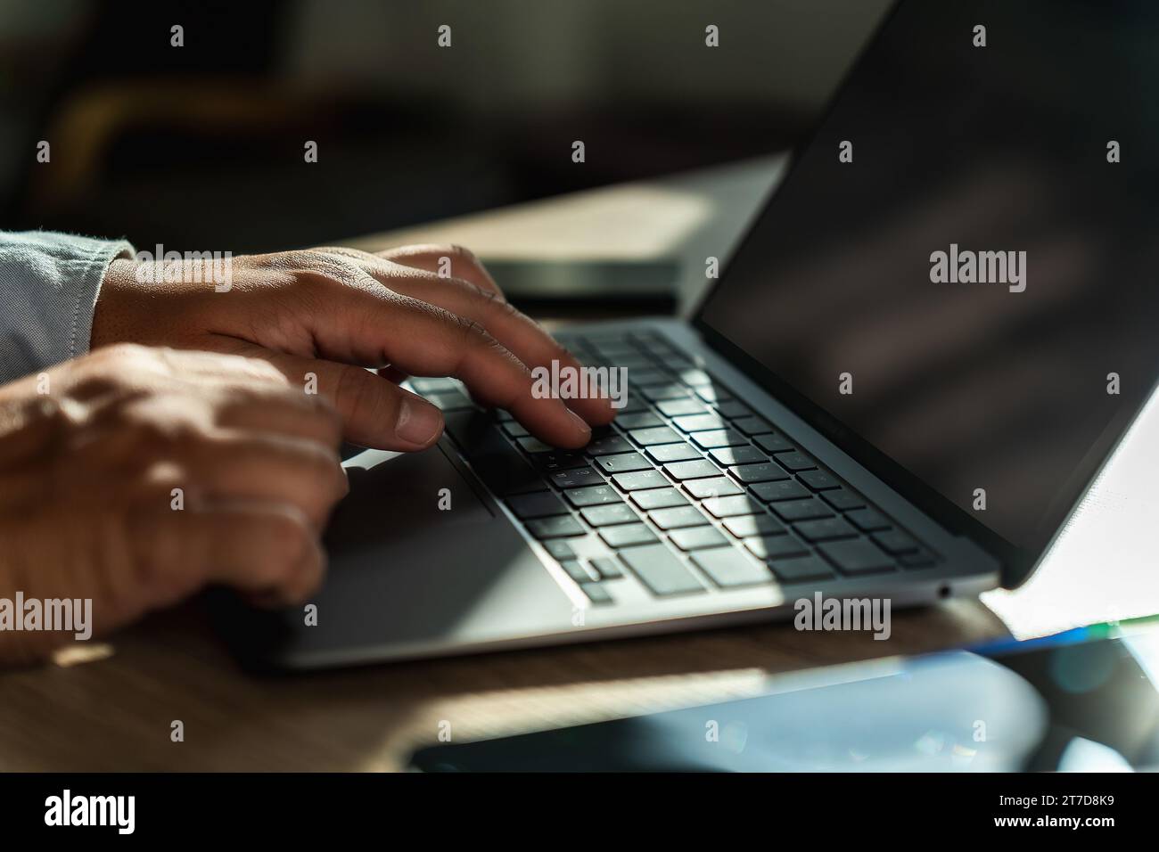 man using a laptop typing, searching, web browsing, online on a computer Search engine optimization SEO technology connection job search Stock Photo