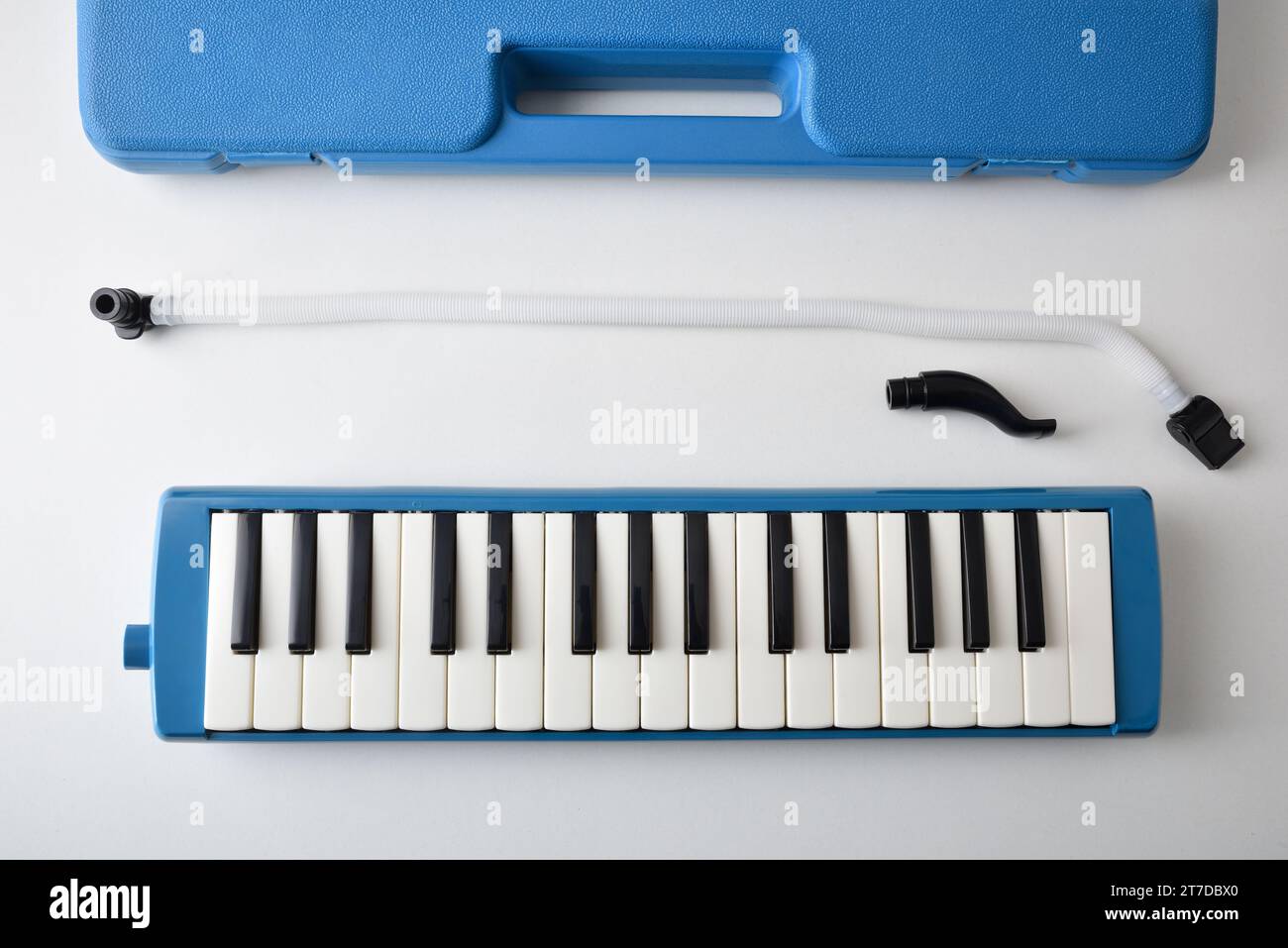 Presentation of melodica and all its components for use on white table