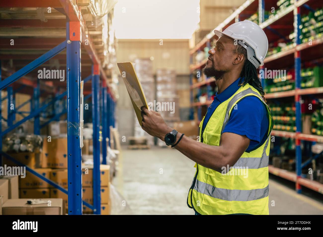warehouse african black male worker. inventory clerk staff stock