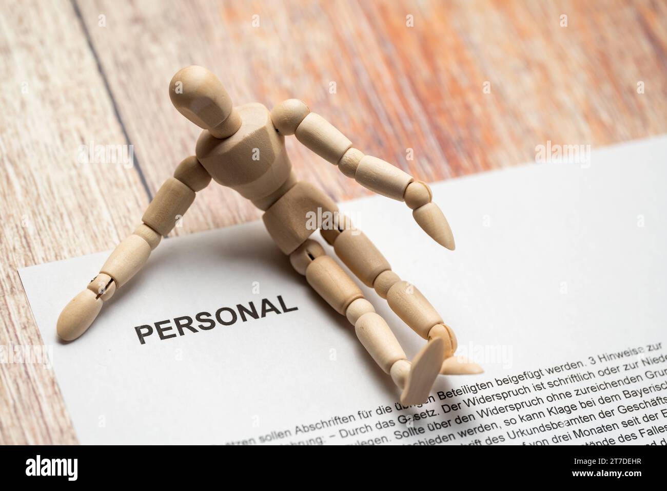 February 25, 2023: Wooden figure on a document with the inscription Personal *** Holzfigur auf einem Dokument mit Aufschrift Personal Credit: Imago/Alamy Live News Stock Photo