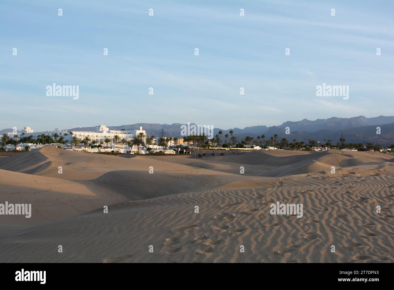 Sand dunes of Maspalomas with a view to the town of Playa del Inglés on the Canary Island of Gran Canaria, Spain, Europe. The huge sand dunes resemble Stock Photo