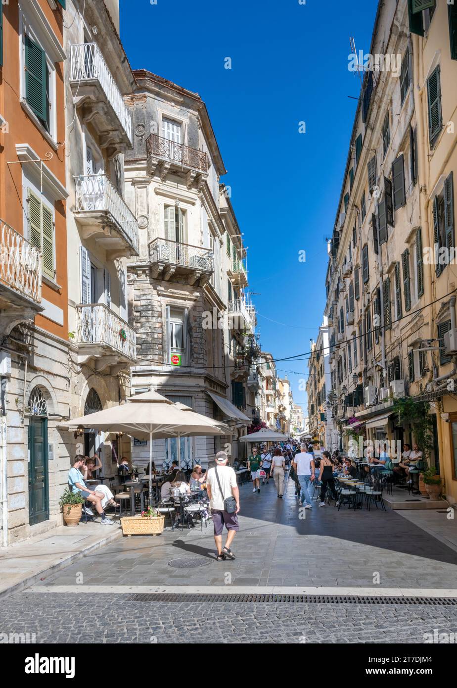 People milling in a shopping street within Corfu Old Town, Corfu., Greece Stock Photo