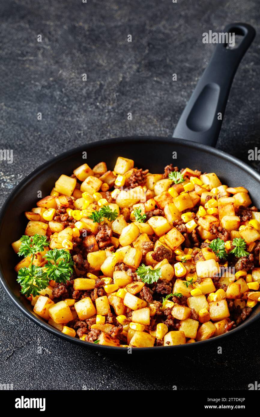 Beef Hash with roasted corn, garlic and parsley on a skillet on ...