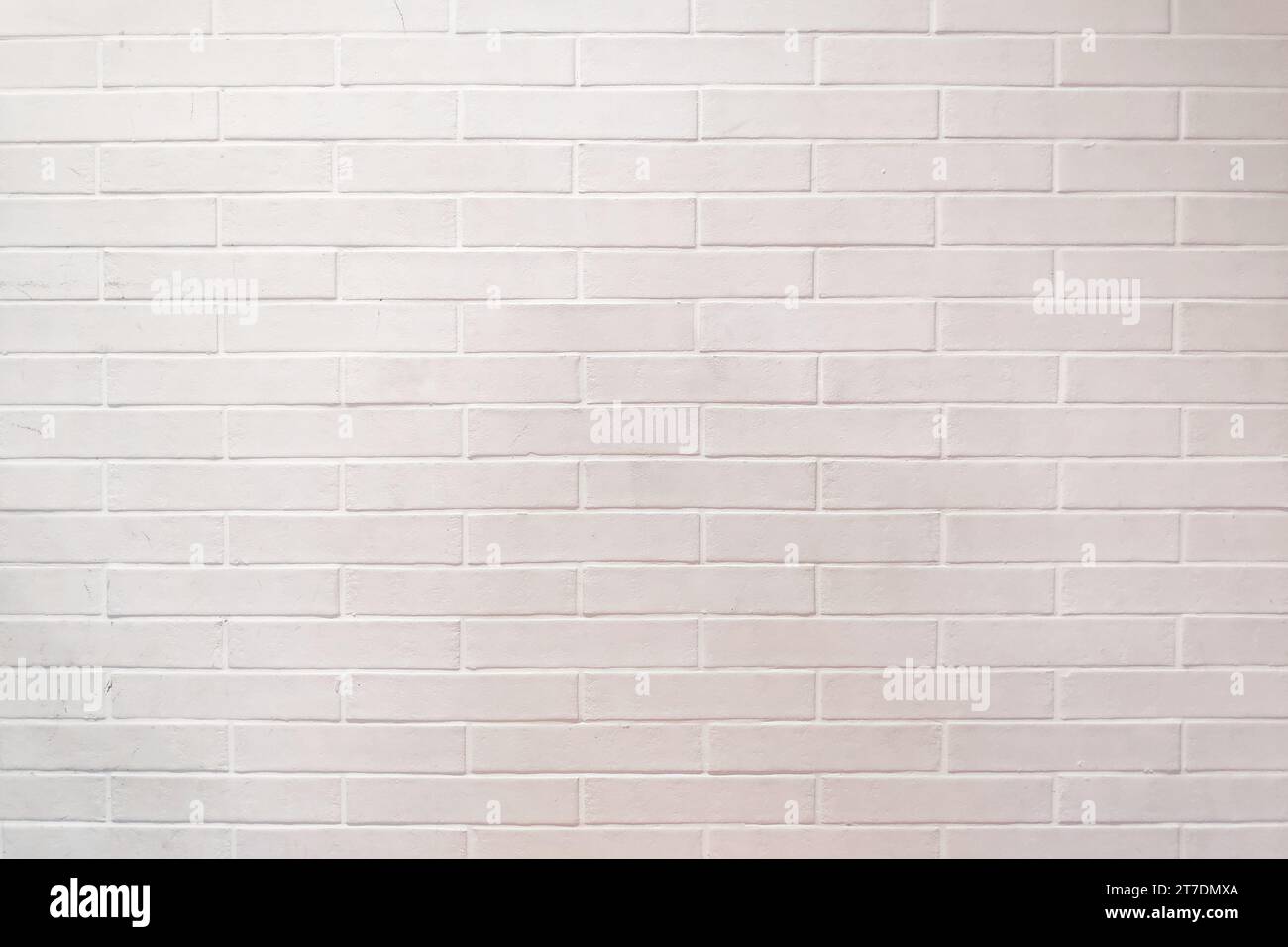 Full frame close up on a brick wall painted in white. Stock Photo