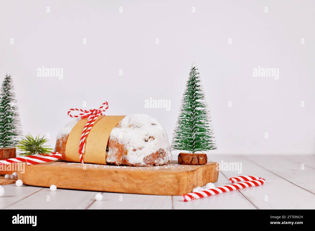 German Stollen cake, a fruit bread with nuts, spices, and dried fruits with powdered sugar traditionally served during Christmas time Stock Photo