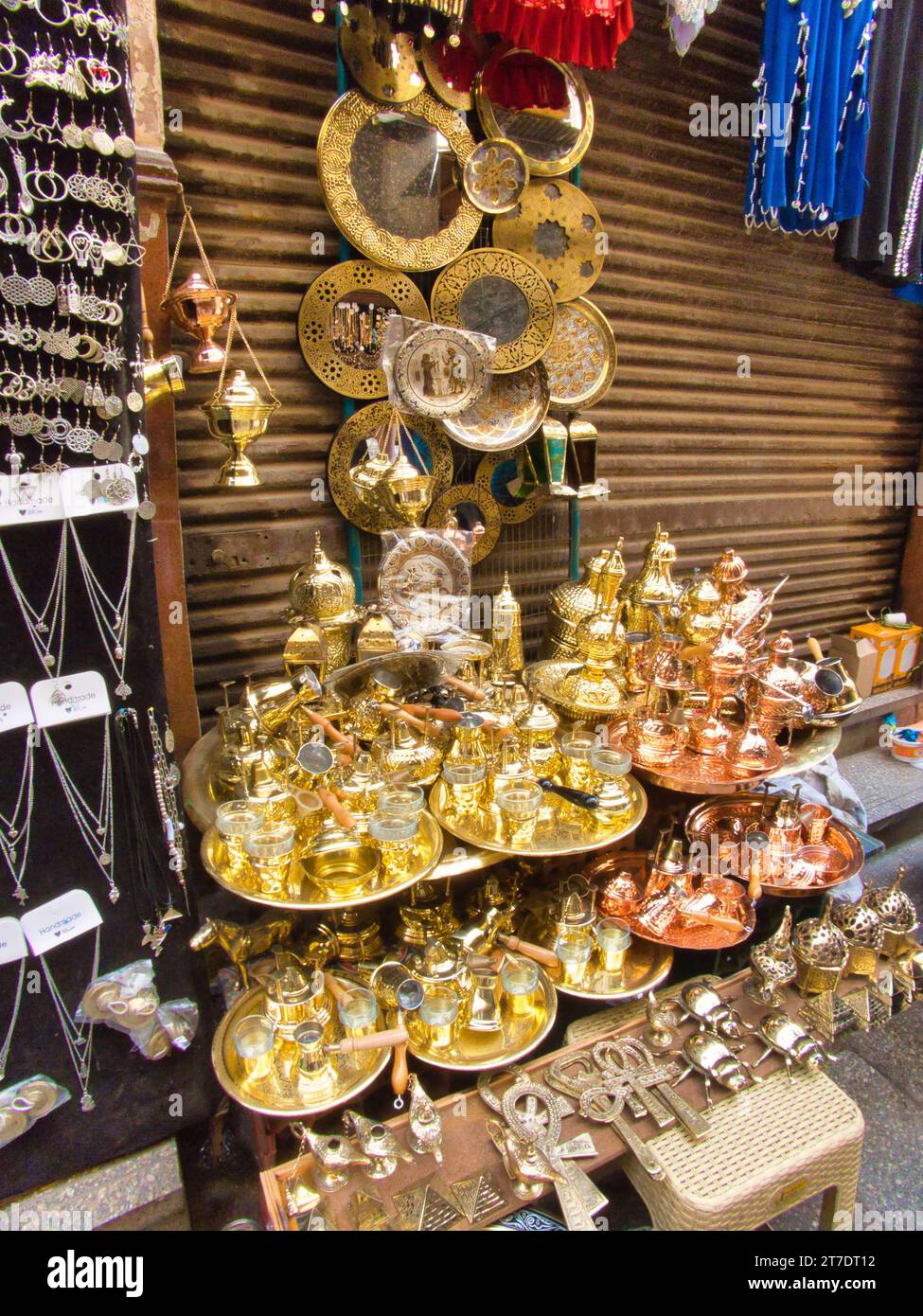 An interior shot of a retail store filled with a variety of golden objects and merchandise Stock Photo