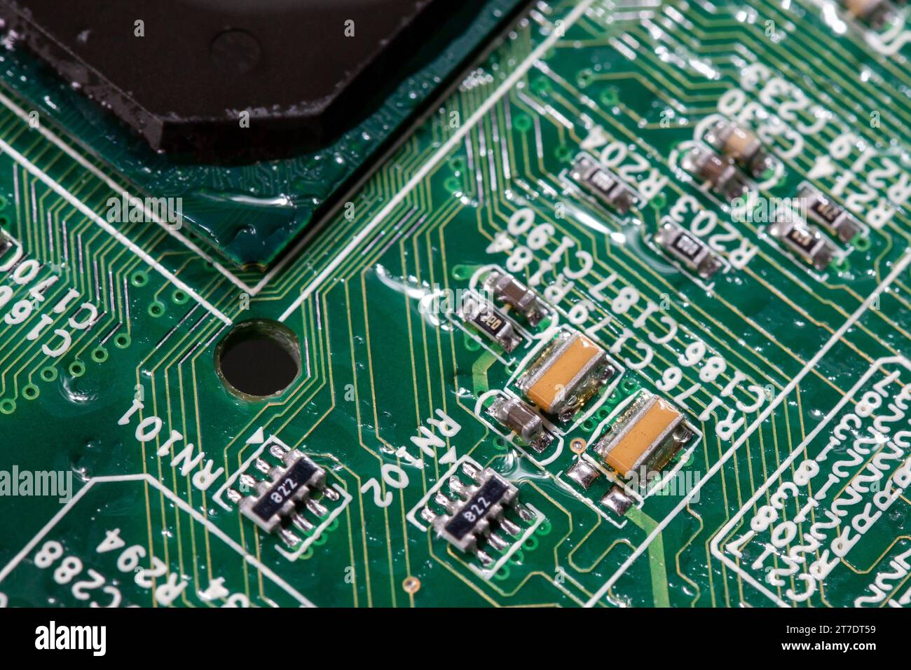 wet digital circuit board with microprocessors and components, closeup