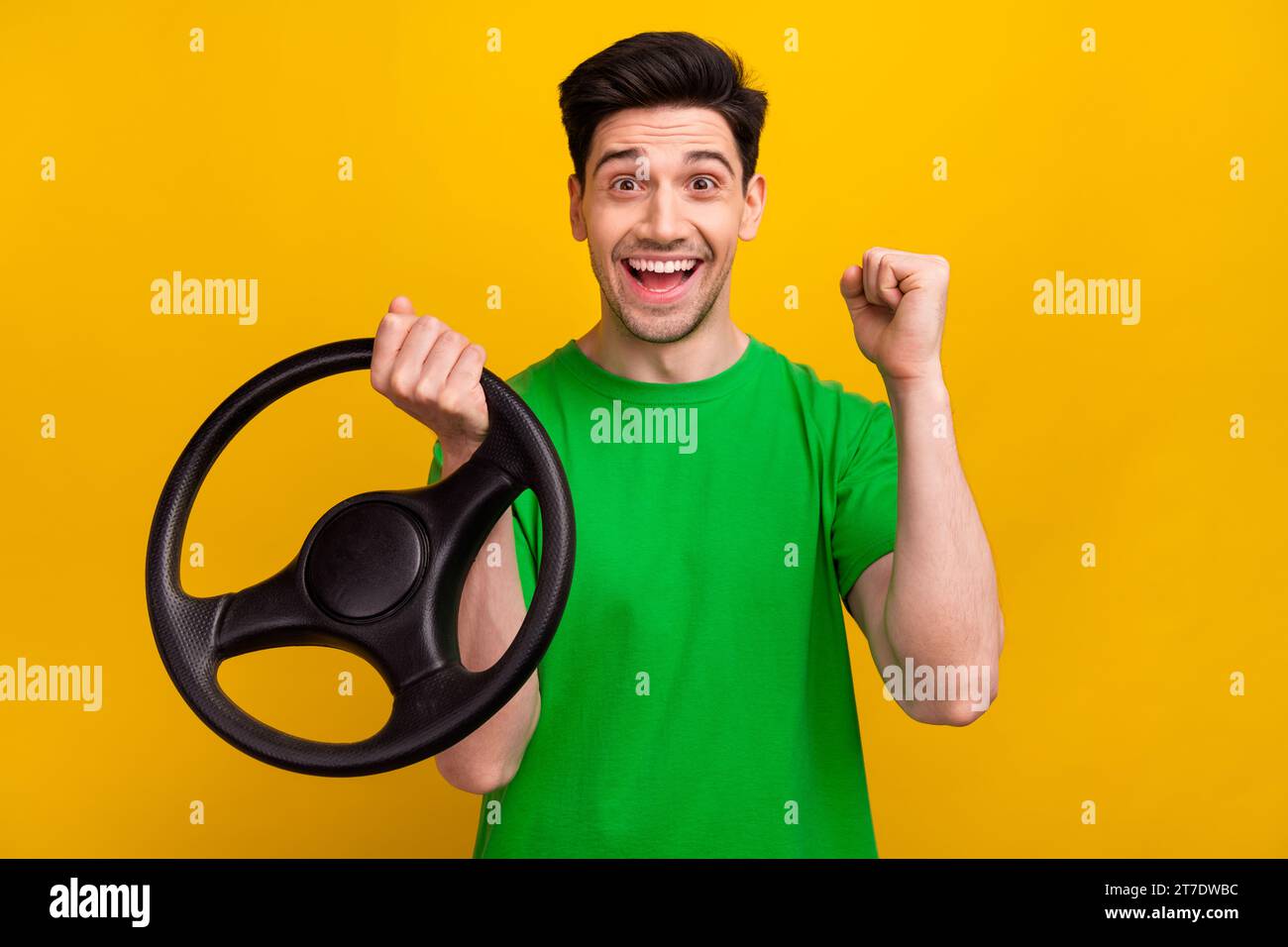 Photo portrait of nice young brunet male shocked excited hold rudder ...
