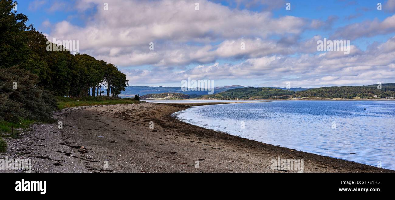 On a bright and peaceful afternoon, looking south west towards Oitir across Loch Fyne from Otter Ferry, Argyll, Scotland Stock Photo