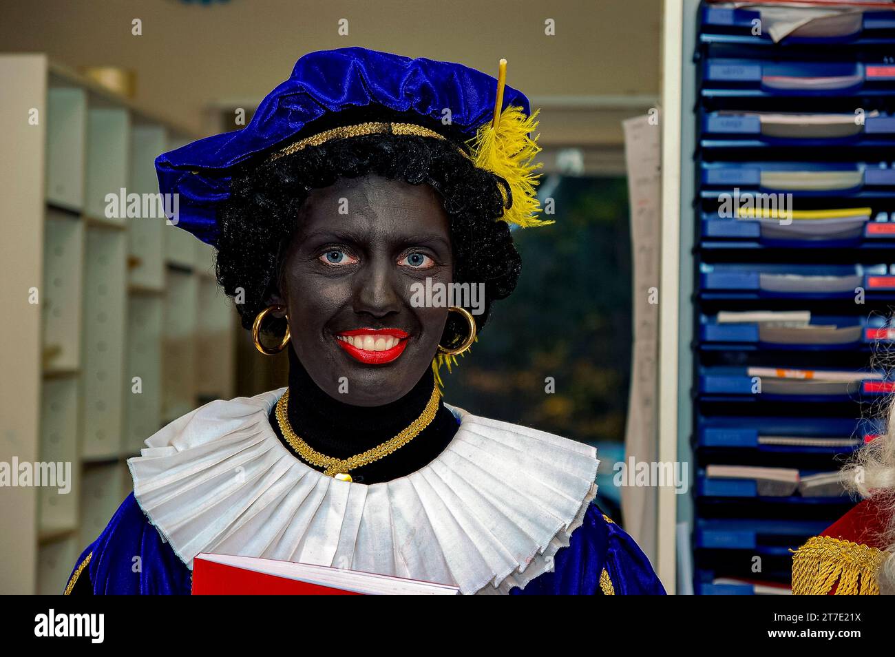 Black Piet / Zwarte Piet, portrait, is a controversial, Dutch figure, connected to Sinterklaas. Black Piet / Zwarte Piet assists, has a submissive role and, since he's (made) Black, a Discriminatory Symbol of Colonialism. This figure is protested against by the 'Kick Out Zwarte Piet'movement. Tilburg, Netherlands. Stock Photo