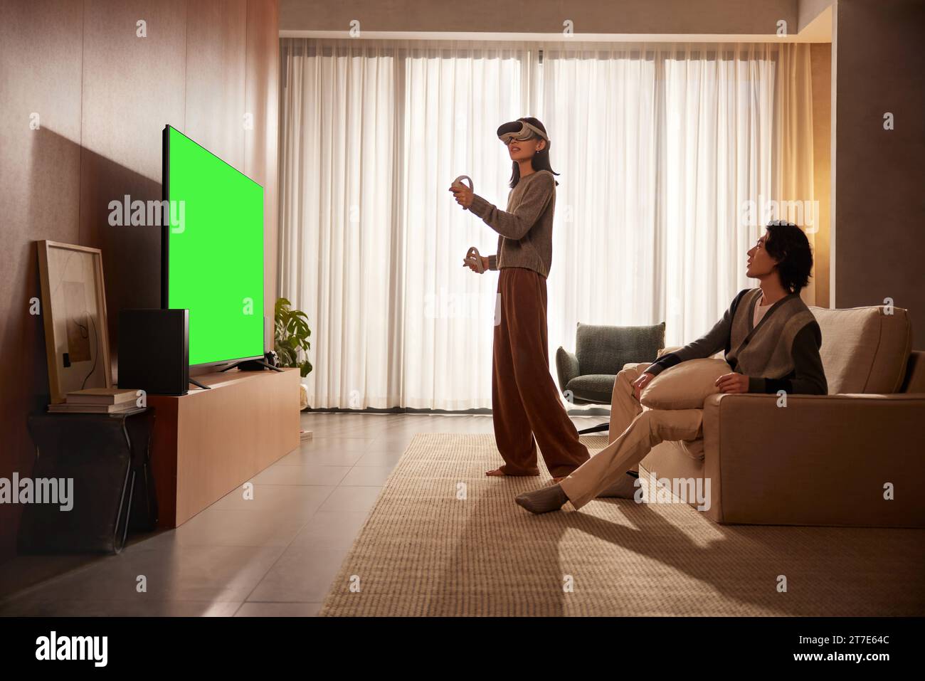 People are watching and enjoying next to the TV, monitor with green