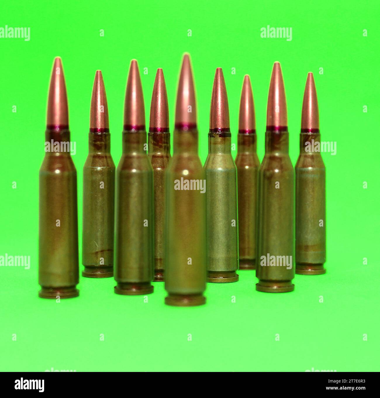 Live ammunition of rifle caliber on a green screen isolated Stock Photo