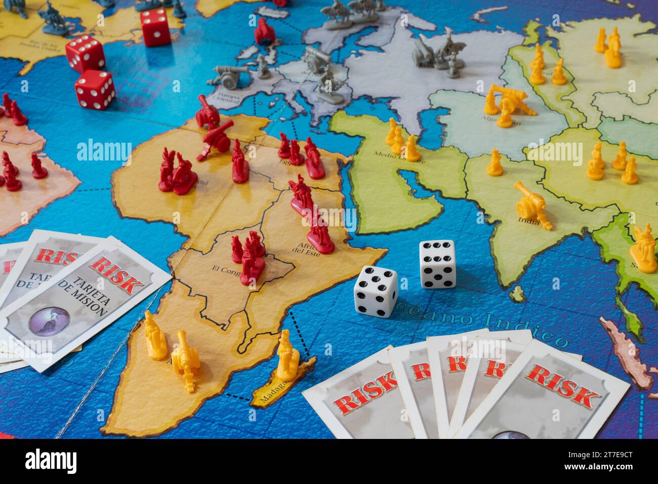 Closeup to a classic risk strategy board game in spanish with dishes