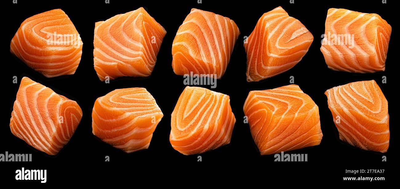 Salmon cubes isolated on black background Stock Photo