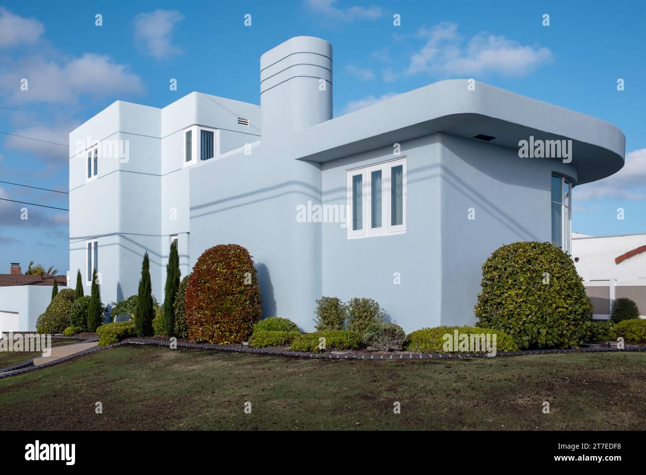 Modern home built in style of Mid Century with garden and blue wall in San Diego, California Stock Photo