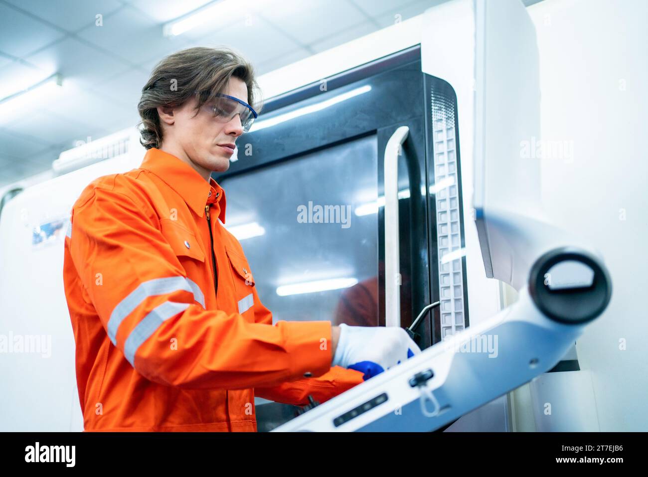 Mechanical engineer using coordinate measuring machine CMM measurement technologies at production line in the industry factory. Stock Photo