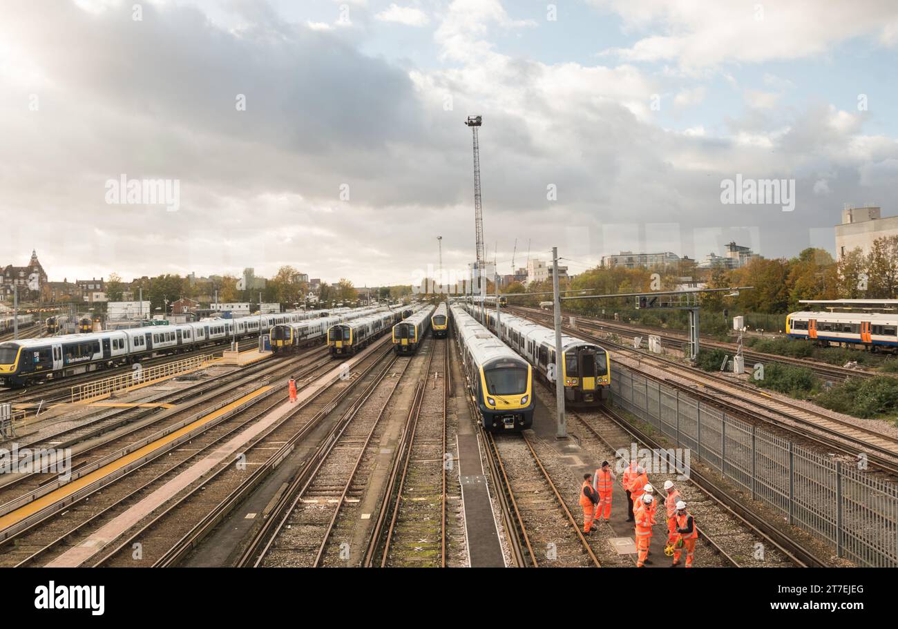 Trains and engineers on the tracks at Clapham Junction station, Clapham Junction, St John's Hill, Clapham, London, England, U.K. Stock Photo