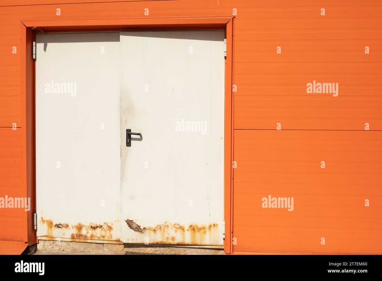 White Door. Technical entrance to building. Login details. Steel door
