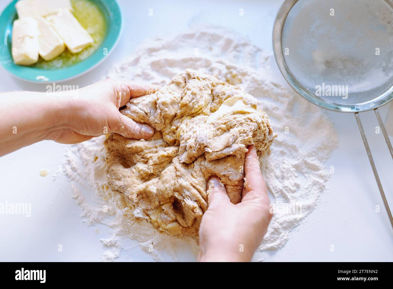 Female hands kneading dough Stock Photo