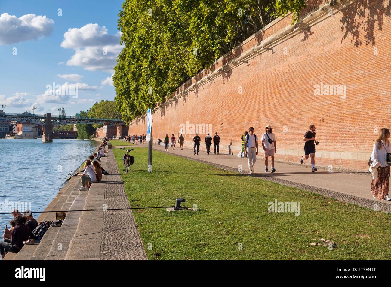 People on the  banks of the Garonne river, Henri Martin Promenade, Toulouse, France Stock Photo