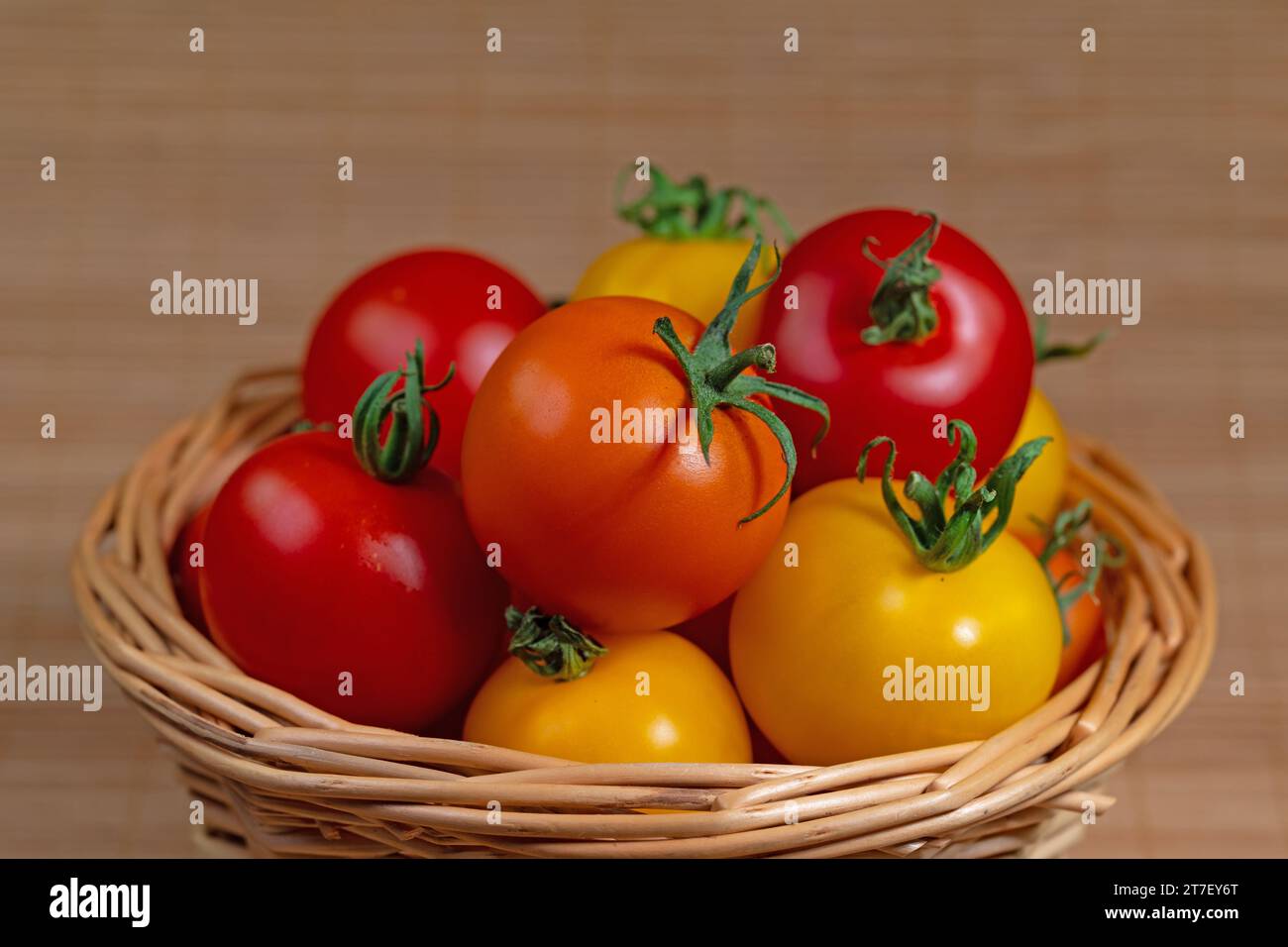 Assorted tomatoes in basket hi-res stock photography and images - Alamy