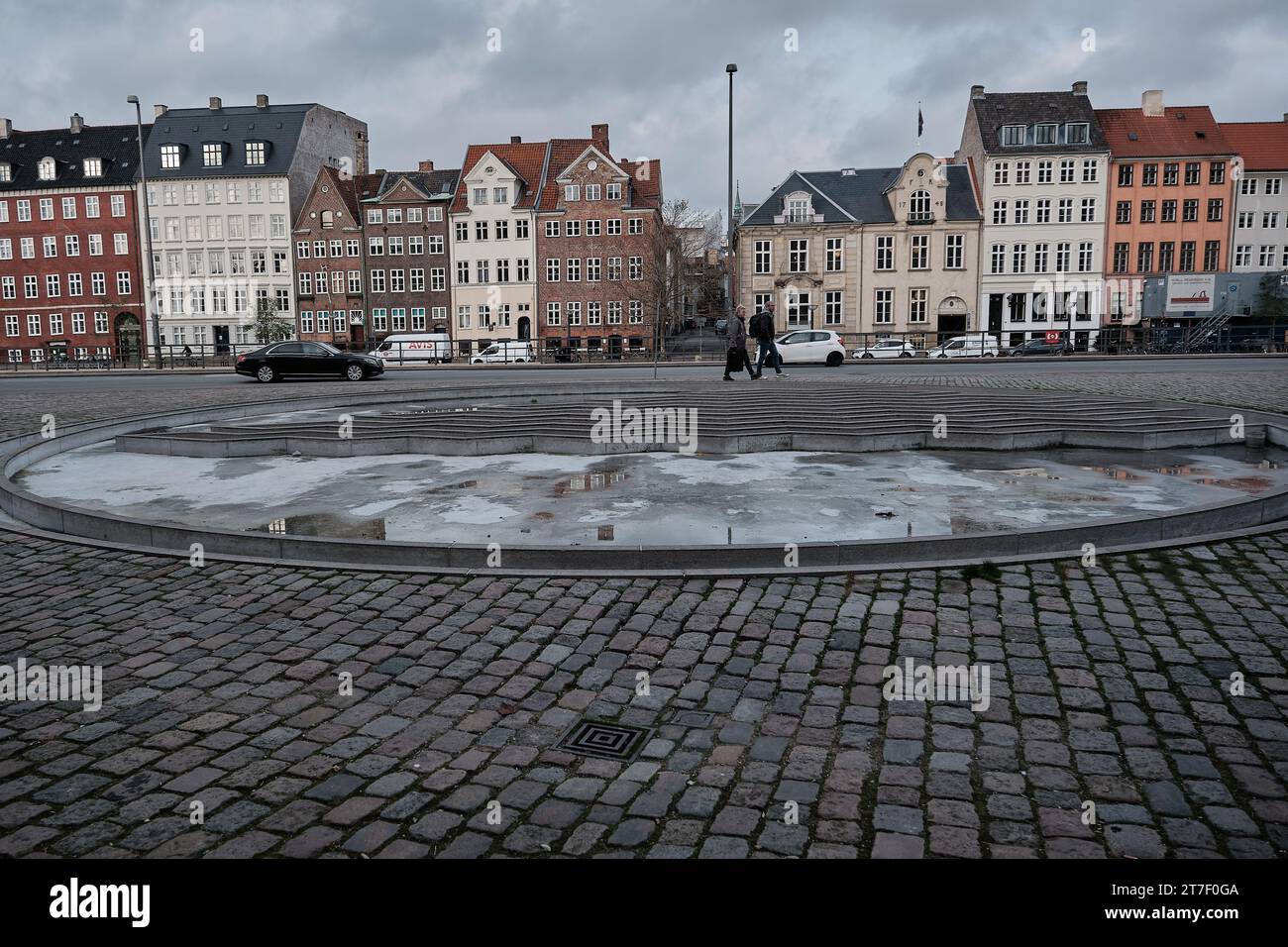 Copenhagen, Denmark; November 28, 2022: image of a beautiful corner of Copenhagen, with two people walking and in the background traditional houses. Stock Photo