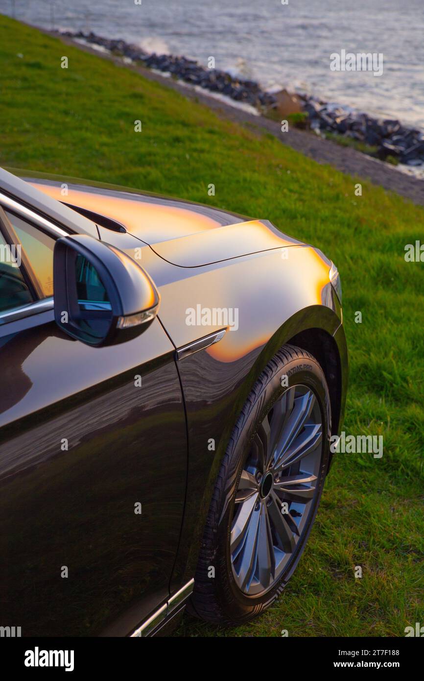 A black car under the sunlight with beautiful sea sunset at seashore Stock Photo Alamy