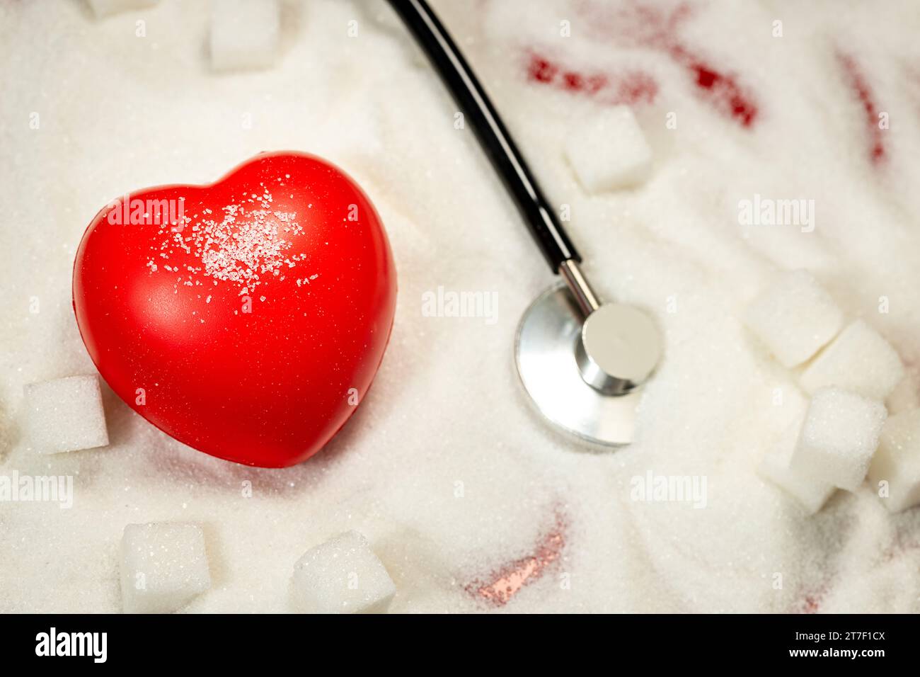 negative effect of sugar on health, health concept, Heart and medical stethoscope lying in white sugar, Healthy lifestyle, Sugar related diseases Stock Photo