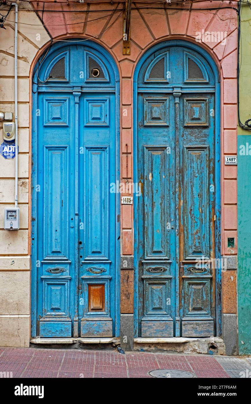 Two blue narrow front doors of colonial houses in the Ciudad Vieja / Old City, historic neighbourhood at capital Montevideo, Uruguay, South America Stock Photo