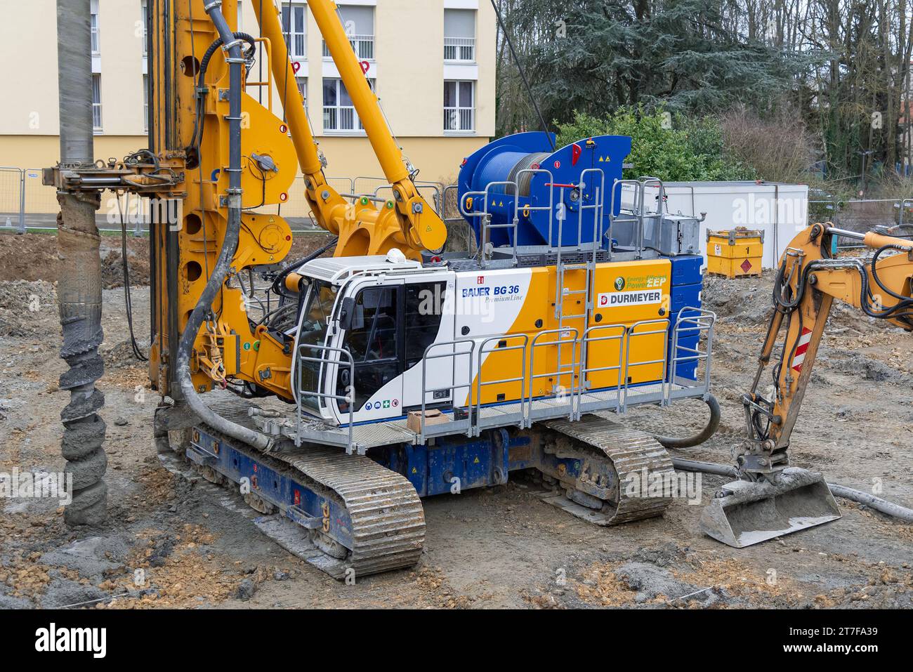 Metz, France - Yellow, white and blue drilling rig Bauer BG 36 on construction site. Stock Photo