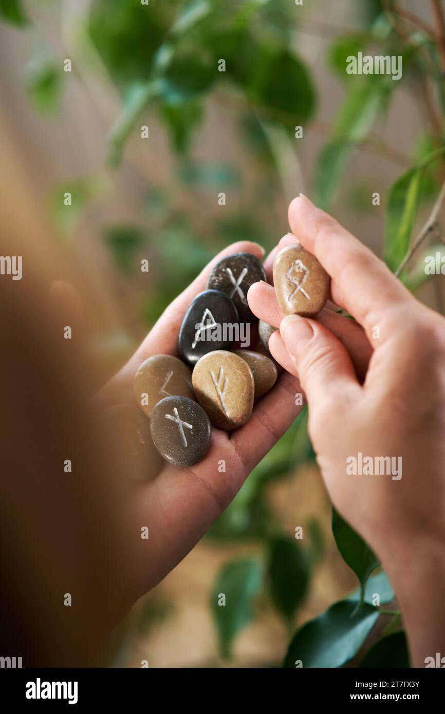 stone runes in a woman's hand Stock Photo - Alamy